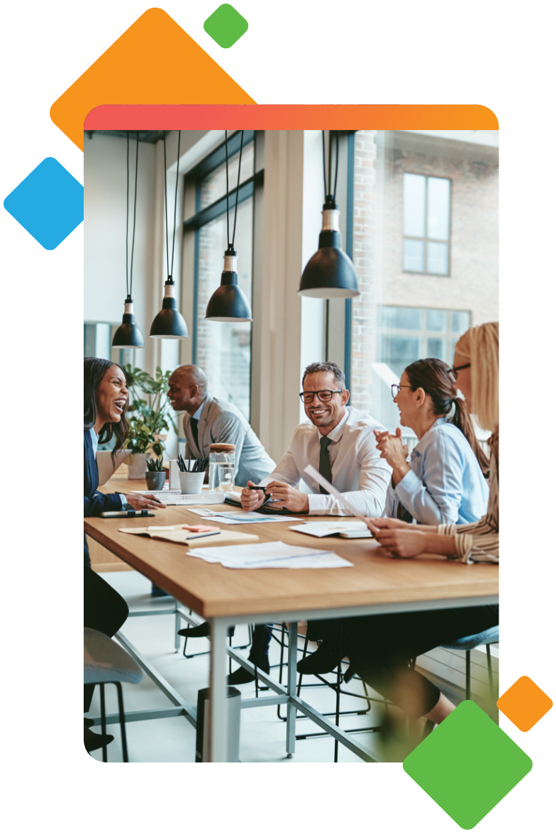 Team members gathered at desk